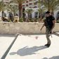 A police officer walks past blood at the Imperiale Marhaba hotel after a gunman opened fire at the beachside hotel in Sousse, Tunisia June 26, 2015.   REUTERS/Zoubeir Souissi