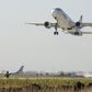 An Airbus A320-211 airplane lands near a new runway which is under construction at the airport of Russia's far eastern city of Vladivostok, October 6, 2010. REUTERS/Yuri Maltsev