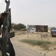 Chadian soldiers drive past a signpost painted by Boko Haram in the recently retaken town of Damasak, Nigeria, March 18, 2015. REUTERS/Emmanuel Braun