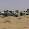 Fighters from the Tuareg separatist rebel group MNLA drive in the desert near Tabankort, February 15, 2015. REUTERS/Souleymane Ag Anara