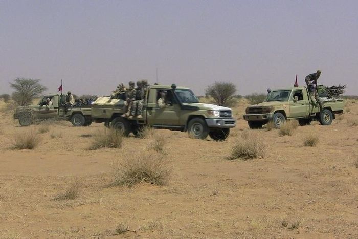 Fighters from the Tuareg separatist rebel group MNLA drive in the desert near Tabankort, February 15, 2015. REUTERS/Souleymane Ag Anara