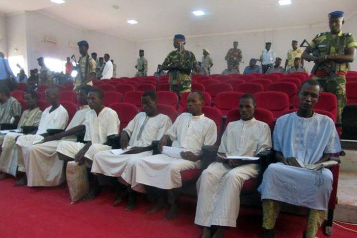 A picture taken Aug. 26, 2015 shows suspected members of Boko Haram sitting in court in N'Djamena.