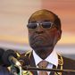 President Robert Mugabe waits to address crowds gathered for Zimbabwe's Heroes Day commemorations in Harare, August 10, 2015. REUTERS/Philimon Bulawayo