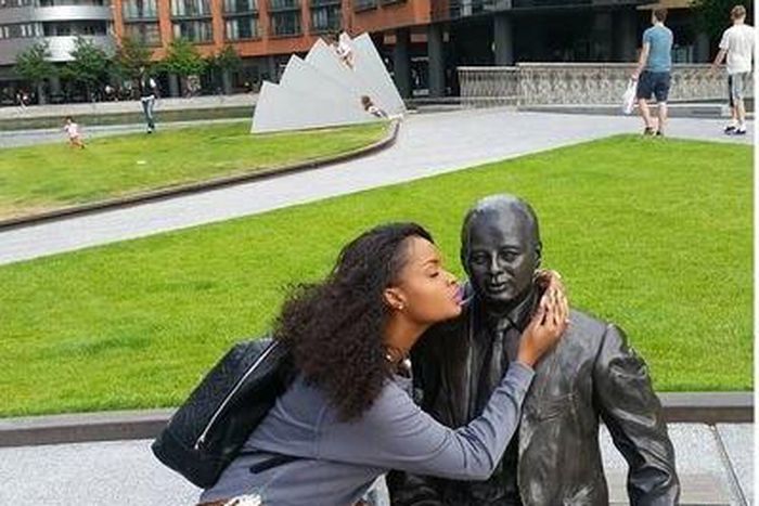 Dillish Matthews kissing a statue