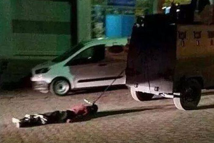 Turkish PM condemns video of militant's body dragged by car