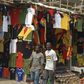 People walk past football memorabilia for sale at a vendor's stall in Ghana's capital Accra  in a file photo.   REUTERS/Yaw Bibini