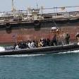 Rescuers find 13 dead migrants on packed boat off Libyan coast