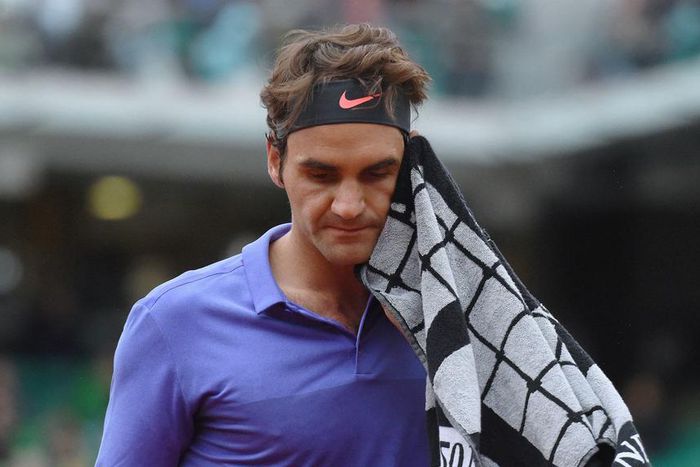 Roger Federer's match held over for bad light