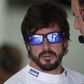 McLaren's Fernando Alonso (L) speaks to a crew member before practice for the Malaysian Grand Prix. Reuters / Olivia Harris