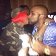 Banky W and Cynthia Morgan exchanging pleasantries in what looks like a soft 'kiss'