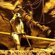 A mine worker is seen underground in South Deep mine outside Johannesburg, in a file photo. REUTERS/Siphiwe Sibeko