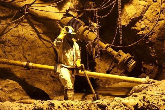 A mine worker is seen underground in South Deep mine outside Johannesburg, in a file photo. REUTERS/Siphiwe Sibeko