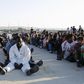 Migrants rest after disembarking in the Sicilian harbour of Augusta, Italy, June 23, 2015.   REUTERS/Antonio Parrinello