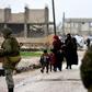 Syrian civilians cross from the rebel stronghold of Idlib into government-held territory on December 27, 2018, taking advantage of the relative calm on the front line since rebel backer Turkey and government supporter signed a truce deal in September