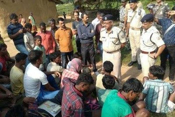 Some police officers and the arrested suspects
