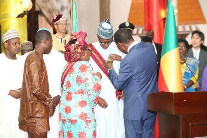 President Muhammadu Buhari receives the Grande Croix Du Benin (The Great Cross of Benin) on August 1, 2015.