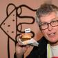 Impossible Foods CEO Pat Brown holds up an Impossible Burger 2.0, the new and improved version of the company's plant-based product that tastes like real beef, at a press event during CES 2019 in Las Vegas