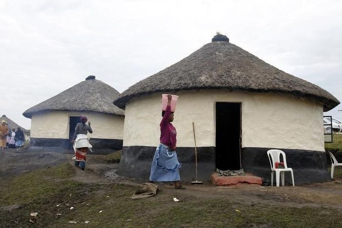 A woman carries a bucket of water outside Mthata, in South Africa's Eastern Cape province, September 8, 2012. REUTERS/Siphiwe Sibeko
