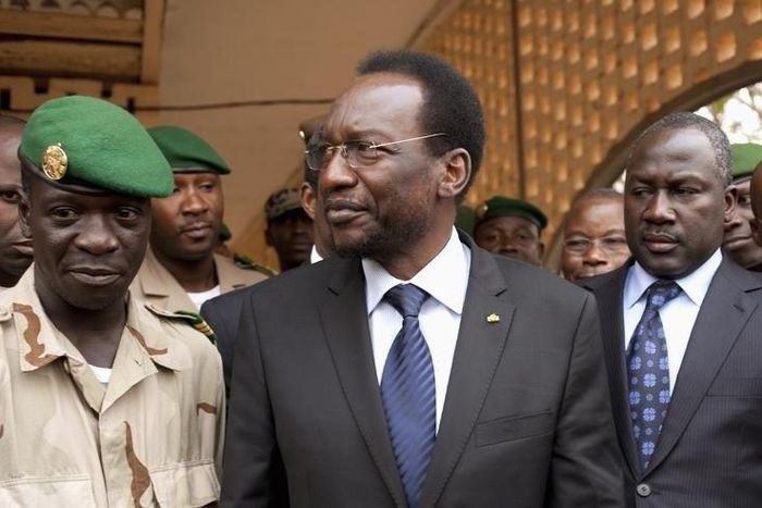 Mali's soon-to-be interim President Diouncounda Traore (C) speaks with military junta leader Amadou Haya Sanogo (L) at a military base in Kati, in a file photo. REUTERS/Joe Penney
