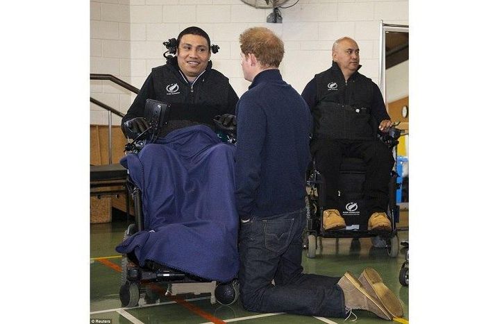 Prince Harry kneels in New Zealand