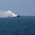 Militants clash with Egyptian coastguard, setting boat on fire