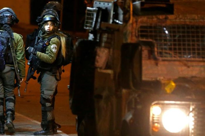 Israeli soldiers clash with Palestinian protesters during an incursion into the West Bank city of Ramallah on January 7, 2019
