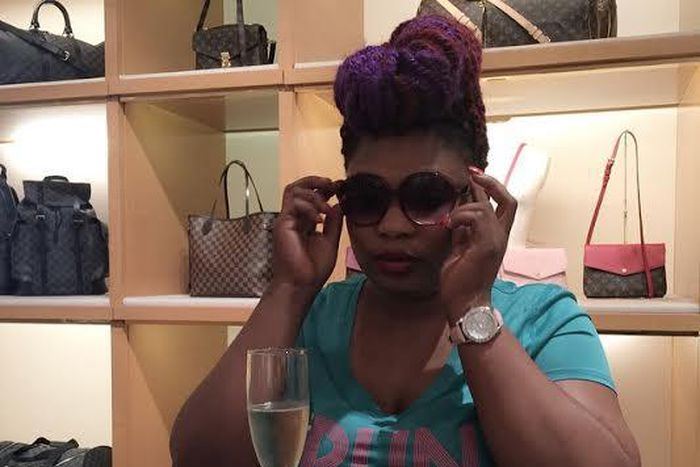 Laide Bakare try on an eye wear at Louis Vouitton store while sipping on an expensive champagne as a customer