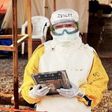 health care worker holding Ebola proof tablet