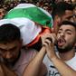 Palestinians carry the body of Aisha Rabi who died after a stone-throwing attack, during her funeral in the West Bank village of Bidiya on October 13, 2018