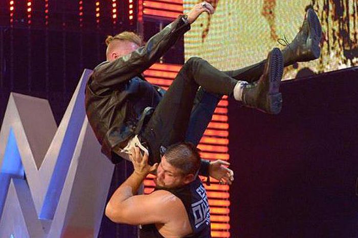 Machine Gun Kelly powerbombed off stage by Kevin Owens