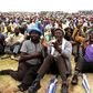 Miners gather at Wonderkop stadium outside the Lonmin mine in Rustenburg, northwest of Johannesburg in this January 30, 2014 file photo.  REUTERS/Siphiwe Sibeko/Files