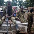 Seleka fighters take a break as they sit on a pick-up truck in the town of Goya June 11, 2014. 
REUTERS/Goran Tomasevic