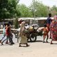 People flee with their belongings in Maiduguri in Borno State, Nigeria May 14, 2015. REUTERS/Stringer