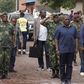 Democratic Republic of Congo's President Joseph Kabila (front C) stands for the national anthem along a street in Goma, a town in eastern Democratic Republic of the Congo, November 30, 2013. REUTERS/Kenny Katombe