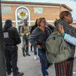 Cuban and Central American migrants leave the Casa del Migrante shelter in Ciudad Juarez, Mexico, before heading to the border to request political asylum in the United States