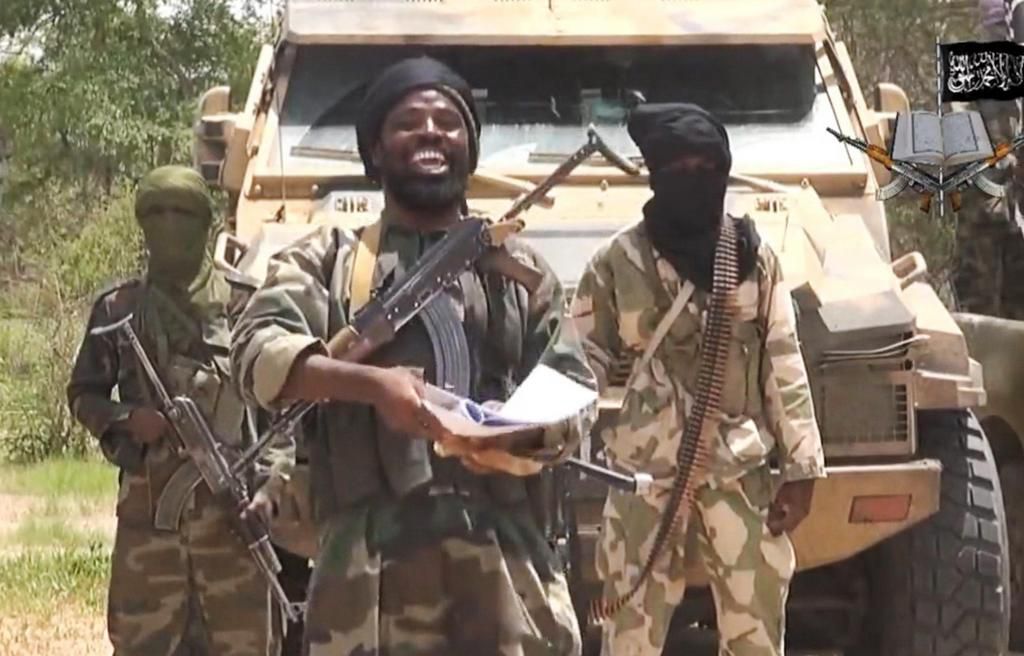 Boko Haram leader, Abubakar Shekau, flanked by his sect members