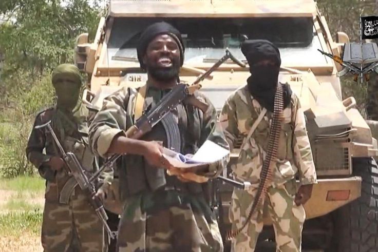 Boko Haram leader, Abubakar Shekau, flanked by his sect members