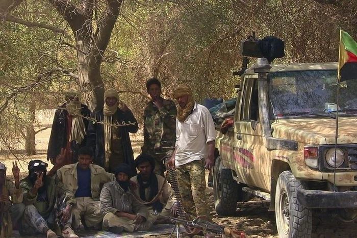 Fighters from the Tuareg separatist rebel group MNLA take shade under a tree in the desert near Tabankort, February 13, 2015.    REUTERS/Souleymane Ag Anara