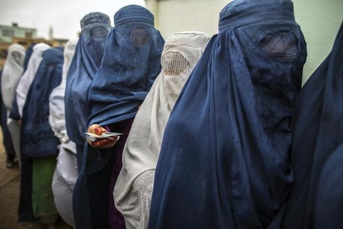 Afghan women stand in line while waiting for their turn to vote at a polling station in Mazar-i-sharif April 5, 2014. REUTERS/Zohra Bensemra