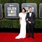 Sandra Oh (L) and Andy Samberg are hosting the Golden Globes