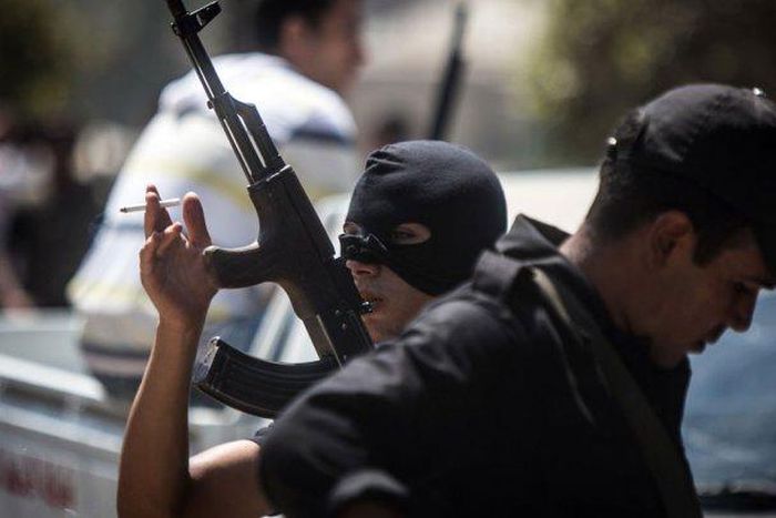 Egyptian police in Cairo on August 14, 2014, during clashes with Muslim Brotherhood supporters following a rally marking the first anniversary of a brutal Cairo crackdown