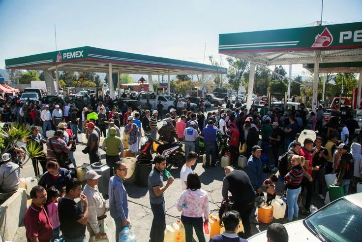 Hundreds of people line up to buy gasoline at a station in Morelia, Mexico amid spiralling shortages