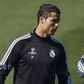 Real Madrid's coach Carlo Ancelotti (R) stands next to Cristiano Ronaldo during their training session at Valdebebas sports ground in Madrid March 9, 2015.
