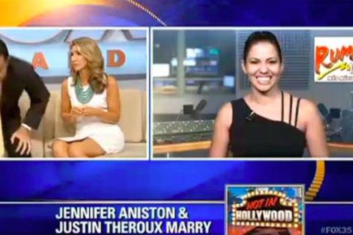 The News anchor, John Brown standing up