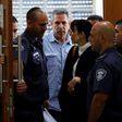 Former Israeli cabinet minister Gonen Segev, seen here being escorted from court after a July 5, 2018 hearing, has reached a plea bargain that will see him serve 11 years in prison for spying for his country's arch-foe Iran