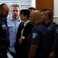 Former Israeli cabinet minister Gonen Segev, seen here being escorted from court after a July 5, 2018 hearing, has reached a plea bargain that will see him serve 11 years in prison for spying for his country's arch-foe Iran