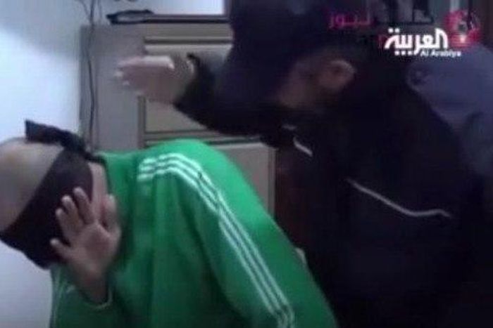 Libya investigates video of guards beating jailed Gaddafi son
