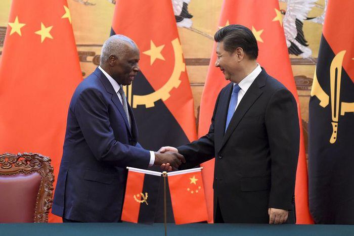 Angola's President Jose Eduardo dos Santos (L) shakes hands with China's President Xi Jinping during a signing ceremony at the Great Hall of the People in Beijing, June 9, 2015. REUTERS/Wang Zhao/Pool