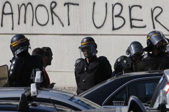 Riot policemen in Paris after the cab drivers riot