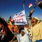 Supporters of Sudanese President Omar al-Bashir shout slogans during a rally in Khartoum on January 9, 2019